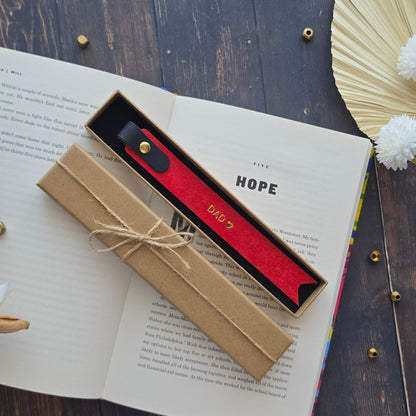 Red leather bookmark personalised with DAD heart in gold foil embossing