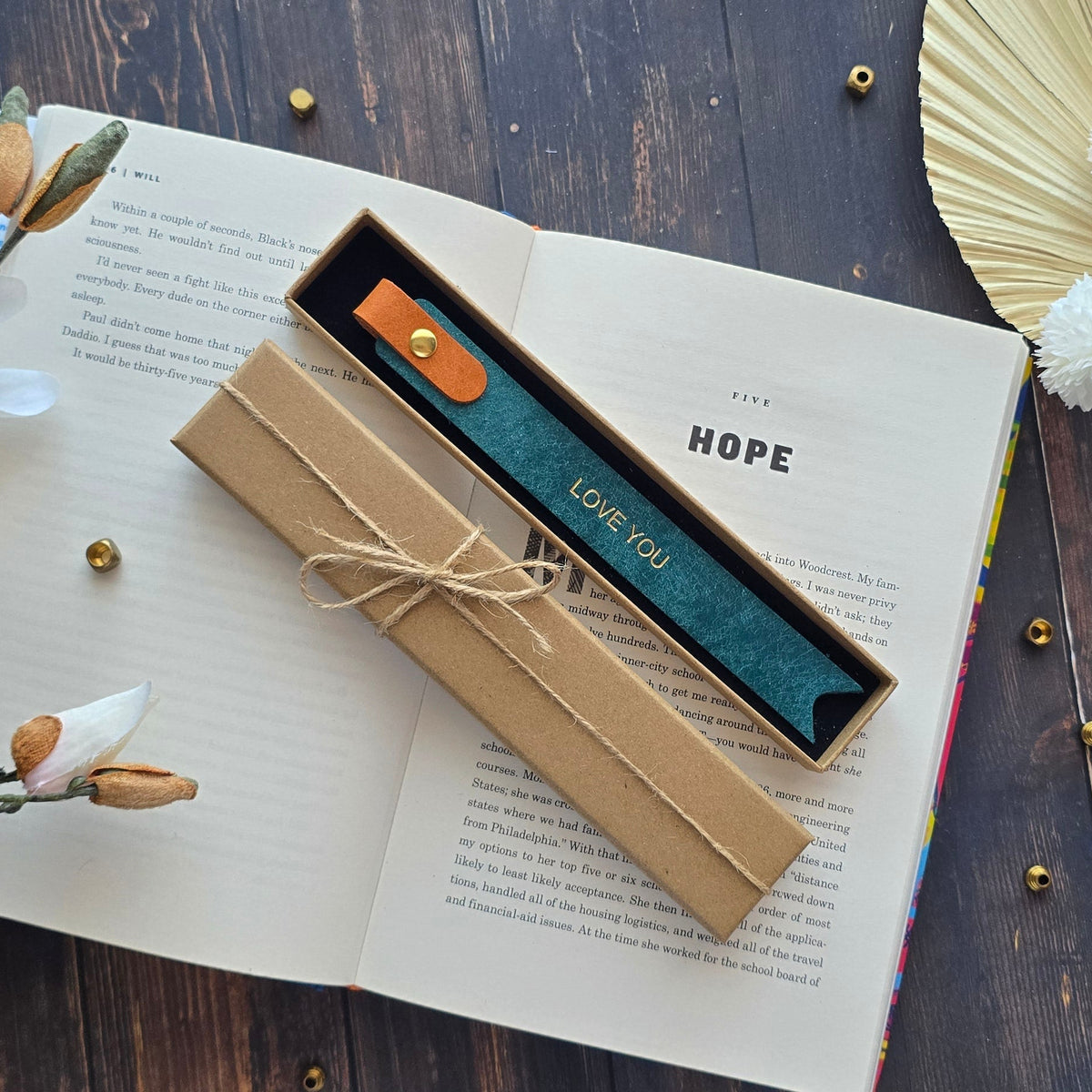 A decorative Leather bookmark with the words 'Love you' in gold script