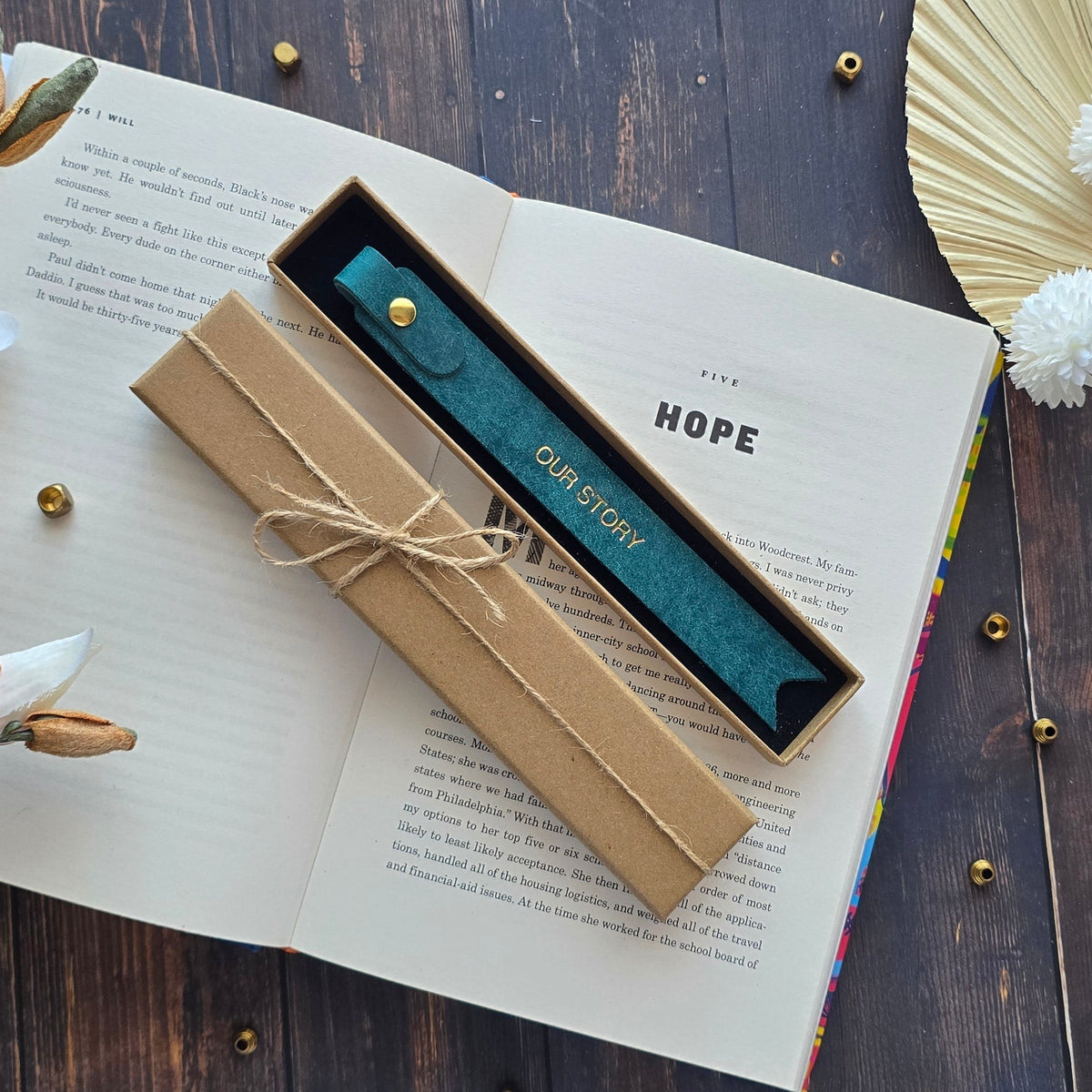leather bookmark personalised with OUR STORY