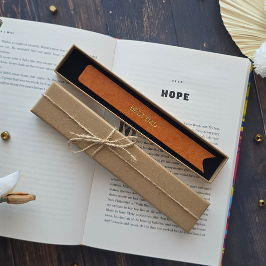 Close up of personalised black leather bookmark for Dad